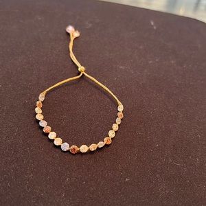 Gold bracelet with stones